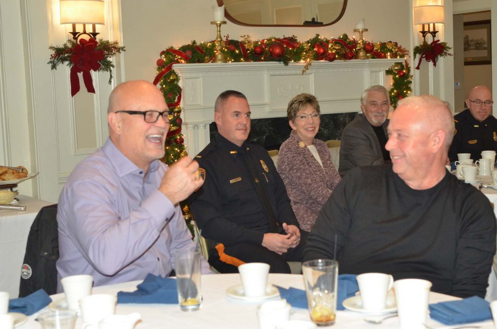 Men laughing together at a law enforcement banquet